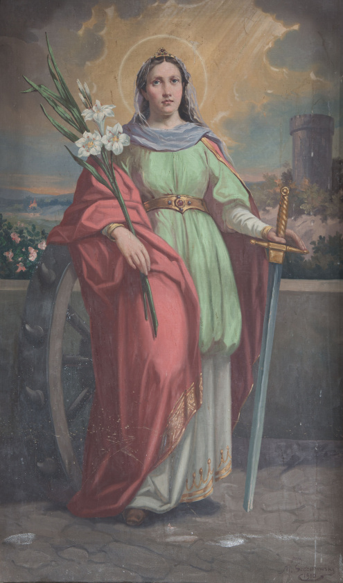 Obraz ołtarzowy z całościowym przedstawieniem św. Katarzyny Aleksandryjskiej, opartej o koło, trzymającej lilię, liść palny oraz miecz, na tle pejzażu z wieżą, w kościele w Trzemeśni.