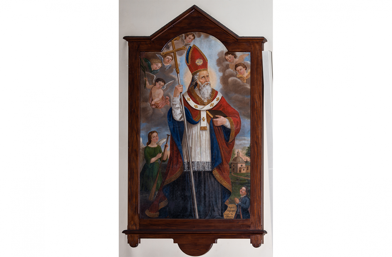 Obraz "Święty Wojciech" w kościele w Jordanowie. Święty ubrany jest w: albę, rokietę, kapę, paliusz i infułę. W ręku trzyma krzyż patriarchalny