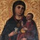 Zdjęcie nr 1: Obraz w kształcie stojącego prostokąta. W centrum kompozycji Matka Boska w typie Hodegetrii ukazana w półpostaci, frontalnie z Dzieciątkiem Jezus na lewym ręku i kwiatem białej lilii w prawej dłoni. Twarz Marii szeroka, z długim nosem, małymi ustami, ciemnobrązowymi oczami. Ubrana jest w ciemnoniebieską suknię oraz ciemnoniebieski płaszcz z czerwoną podszewką i złotą lamówką na brzegu, zarzucony na ramiona i głowę, spięty na piersi złotą, owalną broszką, zdobioną w okuciowe motywy. Dzieciątko ukazane w całej postaci, zwrócone trzy czwarte w prawo, lewą ręką przytrzymuje złote jabłko królewskie, prawą unosi na wysokości piersi w geście błogosławieństwa. Twarz okrągła z długim i szerokim nosem, wąskimi ustami, okolona krótkimi i brązowymi włosami. Jezus ubrany jest w czerwoną suknię z długimi rękawami, zdobioną złotymi rozetkami. Głowy obu postaci ujmują złocone promieniste nimby, otoczone złotym okręgiem. W prawym dolnym narożu obrazu tarcza z godłem herbu Lis oraz sygle „IK”. Tło złote, ryte w ornamenty roślinne. 
