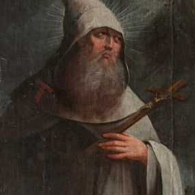 Zdjęcie nr 1: Obraz w formie stojącego prostokąta zamkniętego łukiem nadwieszonym, ujęty profilowaną, złoconą ramą. W centrum obrazu św. Antoni ukazany w całej postaci, zwrócony w trzech czwartych w prawo, z odwróconą w tył głową, w wykroku. W lewej, ugiętej ręce trzyma krucyfiks, prawą wyciągniętą w bok opiera się na lasce. Twarz ma pociągłą, ascetyczną, rysy wydobyte delikatnym światłocieniem, oczy zwrócone ku górze, podkreślone kości policzkowe; wokół głowy nimb promienisty. Twarz okolona długą, siwiejącą, gęstą brodą opadającą na pierś. Święty ubrany w biały habit, z kapturem na głowie. Z prawej strony na barku krzyż tau. Święty ukazany w drodze, na tle pejzażu. Na końcu drogi, po prawej stronie, w połowie wysokości obrazu, widoczna chata z niewielką sceną kuszenia św. Antoniego. Po lewej stronie obrazu pagórek. Powyżej ukazane ciemne szaroniebieskie niebo z skłębionymi chmurami. Postać oświetlona z prawej strony. Kolorystyka z przewagą tonów ciepłych, szarobrązowych. Silny, kontrastowy światłocień, delikatne przejścia tonalne.