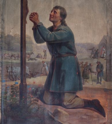 Zdjęcie nr 1: Obraz w kształcie stojącego prostokąta. W centrum kompozycji św. Izydor Oracz modlący się przed krzyżem. Święty ukazany w pozycji klęczącej, z lewego profilu, z głową lekko uniesioną, z rękoma złożonymi w geście modlitewnym. Święty ubrany w niebieską sukmanę, sięgającą do połowy uda oraz jasnoszare spodnie i ciemnobrązowe buty z wysokimi cholewami. W tle pejzaż wiejski.