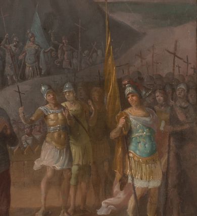 Zdjęcie nr 12: Obraz w formie stojącego prostokąta. Niemal całe pole zajmuje prosty krzyż, do którego przybita jest trzema gwoździami postać żywego Chrystusa. Ciało w lekkim zwisie, o szeroko rozłożonych ramionach układających się w delikatny łuk, uniesiona głowa skierowana w prawo. Twarz okrągła, z oczami skierowanymi w górę, o małym nosie i ustach, okolona krótką brodą i jasnobrązowymi włosami opadającymi na lewe ramię. Na głowie korona cierniowa. Biodra przepasane białym, krótkim, przylegającym do ciała perizonium, ze zwisem tkaniny na prawym boku. Ciało szczupłe, o lekko zarysowanej muskulaturze. U podstawy krzyża czaszka. W tle górzysty pejzaż z przedstawieniem kilku grup żołnierzy w zbrojach rzymskich ze sztandarami i krzyżami. U dołu pionowej belki krzyża napis „Poświęcony ten Obraz / R(oku) 1797 dnia 3. / Czerwca”.  

