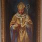 Zdjęcie nr 1: Obraz w formie stojącego prostokąta. W centrum św. Stanisław ukazany frontalnie, do kolan, z pochyloną głową. W lewej ręce trzyma pastorał, w prawej, ugiętej podtrzymuje otwartą księgę. Twarz ma trójkątną, o dużych oczach, skierowanych w dół, dużym nosie i pełnych ustach. Ubrany jest w białą rokietę oraz obfity żółty ornat z niebieską podszewką, na piersi ma zawieszony paliusz, na głowie żółtą infułę z dekoracyjnym galonem i krzyżem z przodu. Postać ukazana na cieniowanym brązowo-niebieskim tle. Na okładce książki sygnatura „Wojciech Eljasz 1876”. 