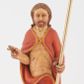 Zdjęcie nr 1: Pełnoplastyczna rzeźba Chrystusa Zmartwychwstałego stojącego na chmurze z prawą ręką wzniesioną w geście błogosławieństwa, lewą trzymającego krzyż na długim drzewcu. Twarz szeroka, z wydatnym nosem, ciemnobrązowymi oczami, ciemnoróżowymi ustami, okolona zarostem oraz włosami z przedziałkiem pośrodku głowy, opadającymi na plecy. Karnacja jasnobeżowa. Chrystus ukazany nagi, przesłonięty czerwonym płaszczem, spiętym na piersi, opadającym ukośnymi fałdami do ziemi. 
