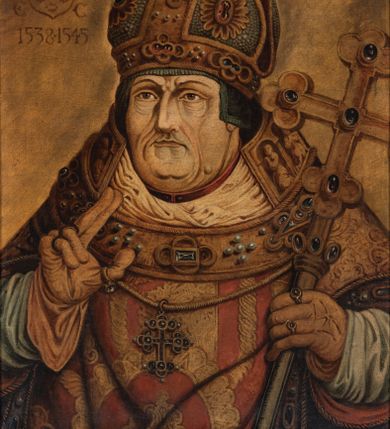 Zdjęcie nr 1: Biskup zwrócony jest trzy czwarte w prawo z prawą ręką wzniesioną w geście błogosławieństwa, w lewej trzyma pastorał w formie krzyża. Twarz szeroka i pokryta licznymi zmarszczkami, oczy wąskie, nos długi i orli. Biskup ubrany jest albę, ornat, humerał, infułę oraz złote rękawice, na szyi na zawieszony krzyż pektoralny. Tło jednolite, jasnobrązowe. W lewym, górnym narożu obrazu tarcza ujęta labrami i zwieńczona infułą z godłem herbu Sulima oraz literami „P[ETRUS] G[AMRAT] / E(PISCOPUS) C(RACOVIENSIS)” i daty „1538-1545”. Na odwrociu napis: „KOPIA / Z KOŚCIOŁA / X.X. FRANCISZKANÓW / W KRAKOWIE / R. 1882. / L. L.” oraz karteczka z napisem: „ZE ZBIORÓW / KARD. ALBINA / DUNAJEWSKIEGO”. Rama drewniana i profilowana. 