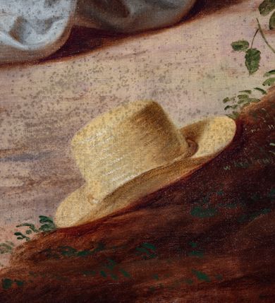 Zdjęcie nr 11: Obraz w kształcie stojącego prostokąta zamkniętego łukiem odcinkowym, w drewnianej szerokiej ramie, malowanej na czerwono i zdobionej złoconymi motywami liści akantu. Na pierwszym planie klęczący święty, ukazany w trzech czwartych, w lewo, w chłopskiej, białej tunice spiętej pod szyją czerwoną wstążką i przepasanej na biodrach brązowym paskiem oraz w spodniach. Ręce wznosi ku górze, w geście modlitwy. Jego twarz o miękkich rysach, zaoblonym nosie, pełnych wargach i płytkich oczodołach wyraża żar wygłaszanej modlitwy. Włosy ma jasne, zaczesane do tyłu. Święty Izydor klęczy przed krzyżem z figurą Chrystusa, ukazanego w silnym skrócie perspektywicznym, na niewielkim ukwieconym pagórku, na którym leży kapelusz. W tle anioł z pługiem zaprzężonym w dwa woły, fragment kościoła w części zasłoniętego starodrzewiem oraz las z pagórkowatym krajobrazem. Niebo jasne, błękitne, zasłonięte w części szarymi chmurami. W prawym dolnym rogu sygnatura „mal[ował] Wojciech Eljasz / 1853”. Na odwrocie „Za staraniem X[iądz] Wojciecha Jenczego / Administratorka Parafii Zielonek / malowano w Krakowie / r[oku] 1853.”